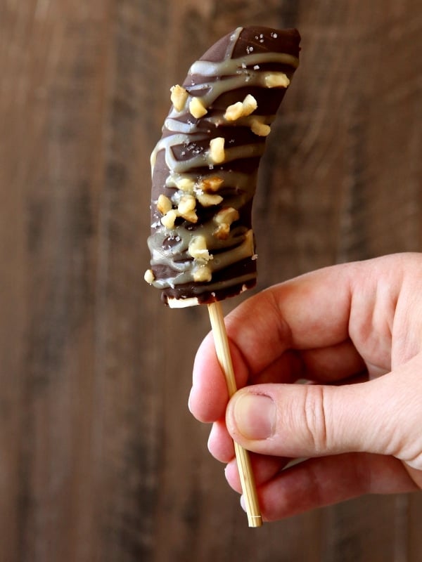 Chocolate Covered Frozen Bananas with Salted Caramel and Walnuts | completelydelicious.com