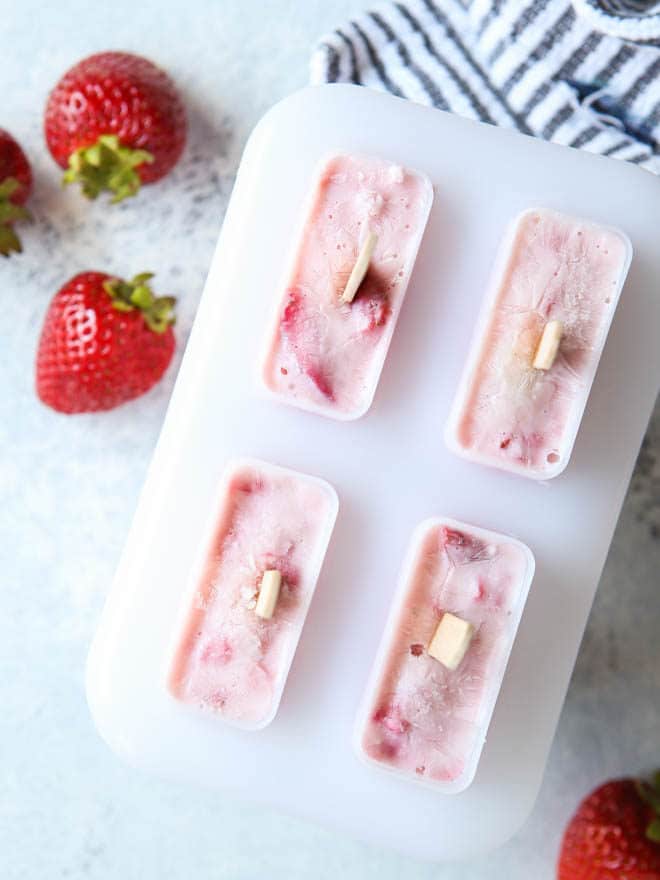 Roasted strawberry yogurt pops heading to the freezer