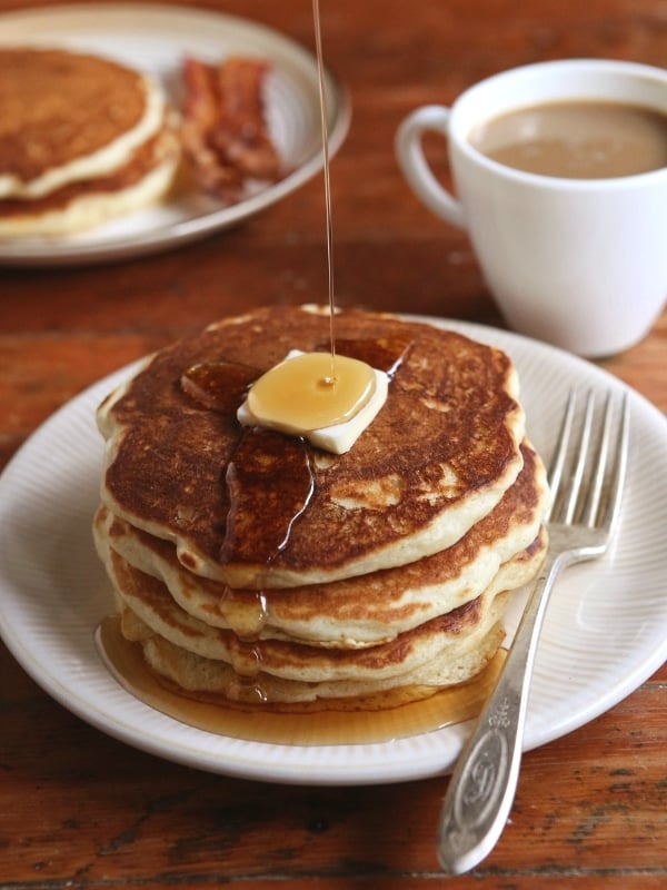 The best buttermilk pancakes - light, fluffy and full of flavor! Find the recipe on completelydelicious.com