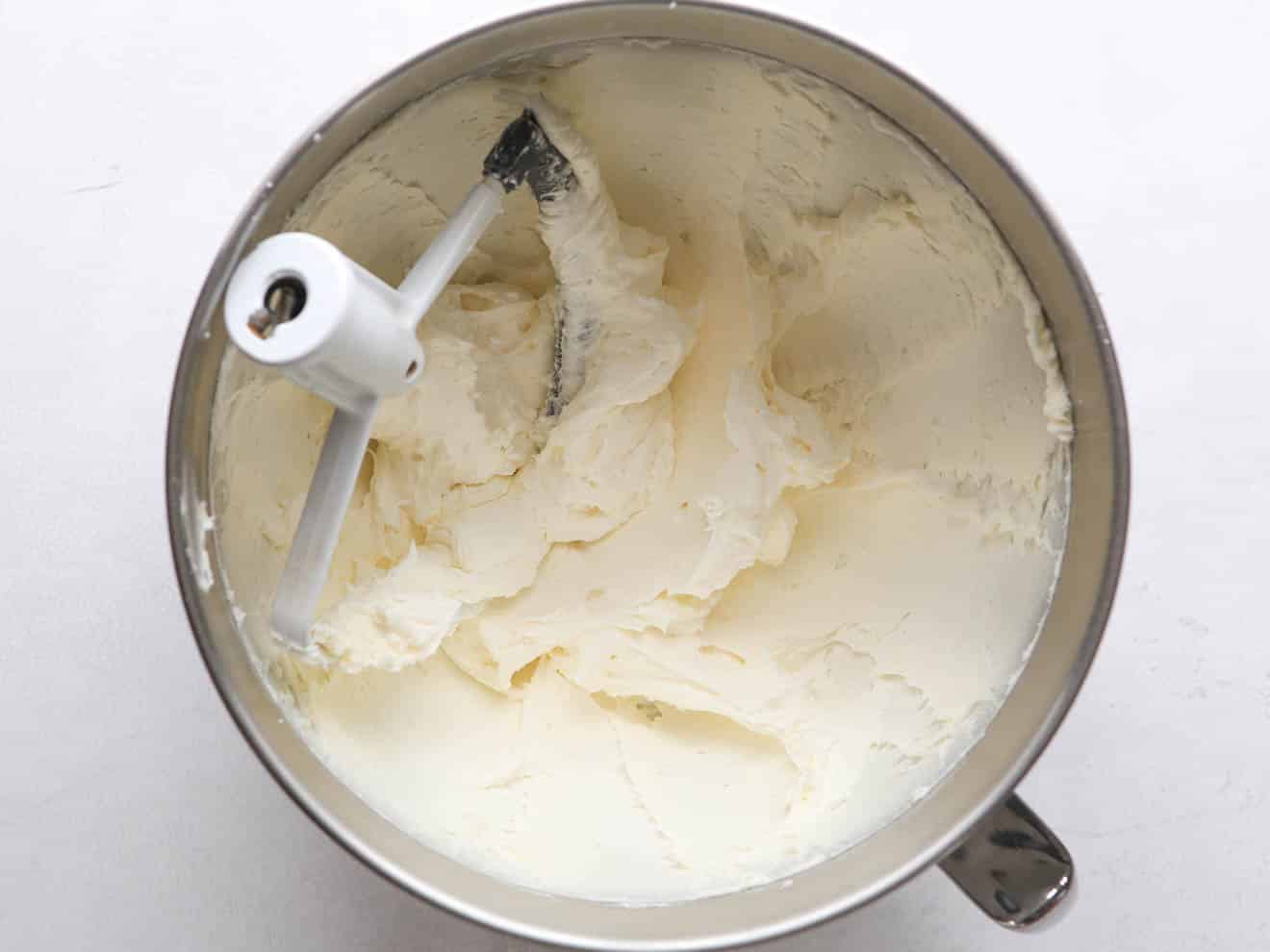 vanilla frosting in mixing bowl