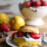 Lemon biscuit shortcakes stuffed with lemon curd, whipped cream, and fresh berries.
