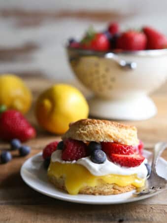 Lemon biscuit shortcakes stuffed with lemon curd, whipped cream, and fresh berries.