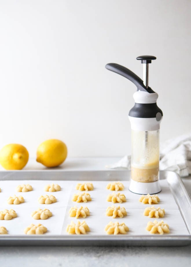 Lemon spritz cookies made with a cookie press