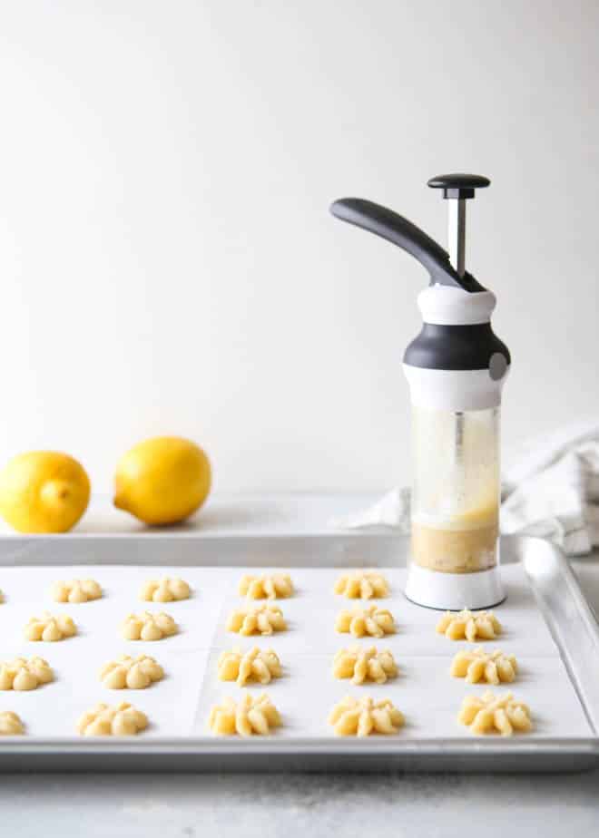 Lemon spritz cookies made with a cookie press