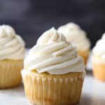 The fluffiest and creamiest vanilla frosting, piled on a cupcake
