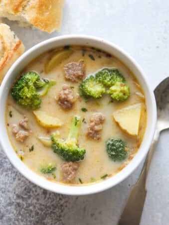 A bowl of hearty sausage, broccoli, and potato soup