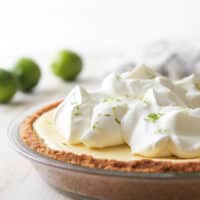This light and creamy tequila lime pie is light, creamy, and has a bit of a fun kick!