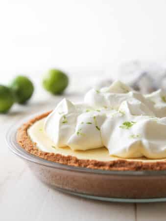 This light and creamy tequila lime pie is light, creamy, and has a bit of a fun kick!