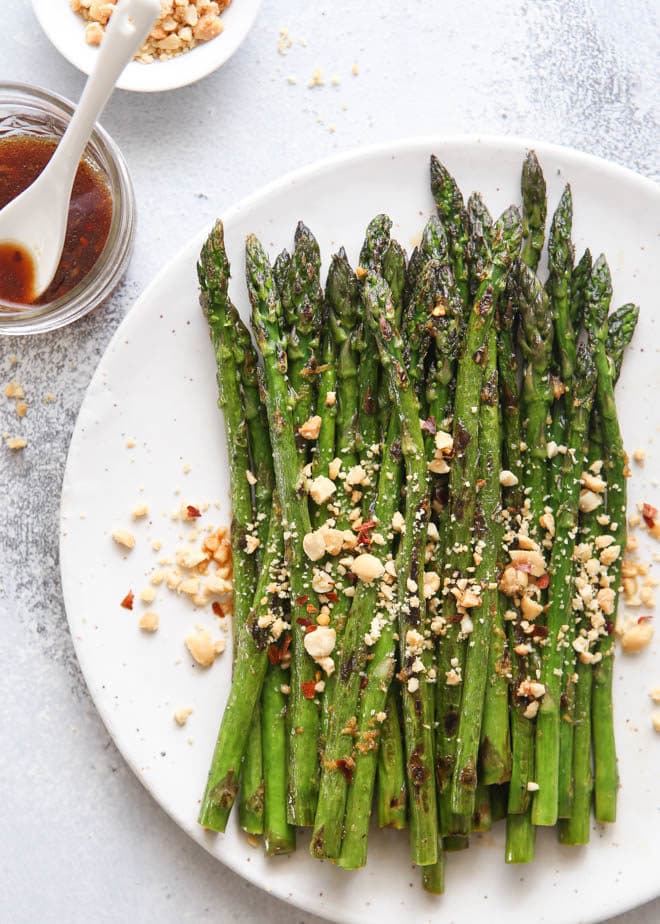 Sauteed asparagus dressed with a ginger-lime sauce and topped with peanuts