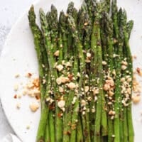 Sauteed asparagus dressed with a ginger-lime sauce and topped with peanuts