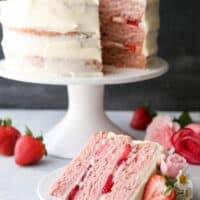 Homemade strawberry layer cake with fresh strawberries and cream cheese frosting