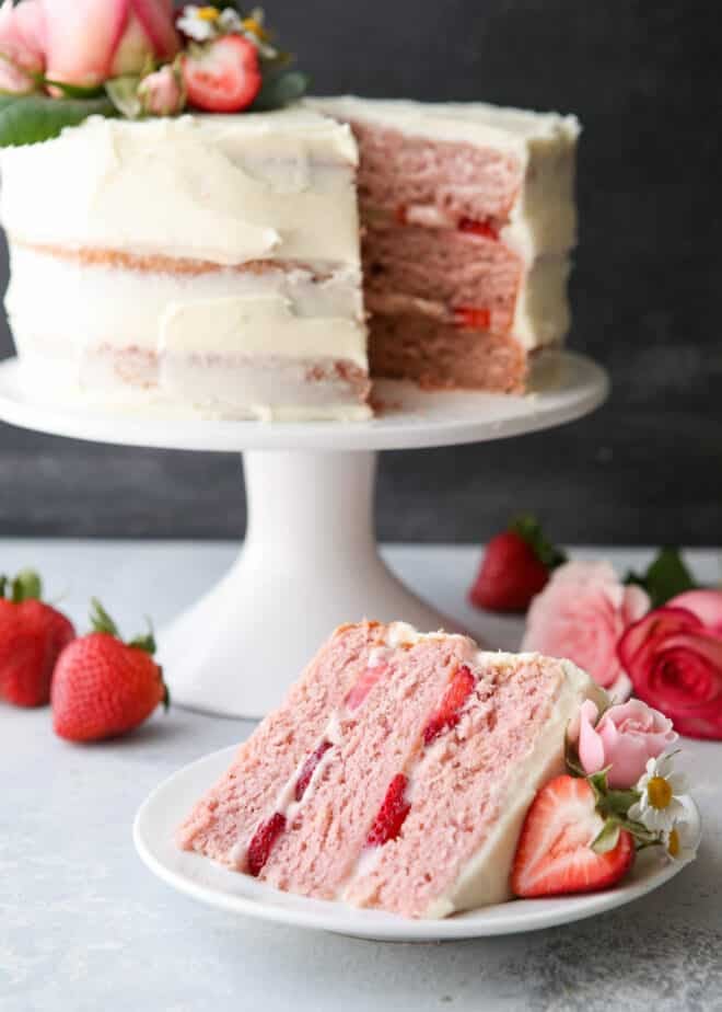 Homemade strawberry layer cake with fresh strawberries and cream cheese frosting