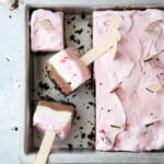 Layers of oreo cookie, chocolate ice cream, vanilla ice cream, and strawberry ice cream make up these fun Neapolitan ice cream pops