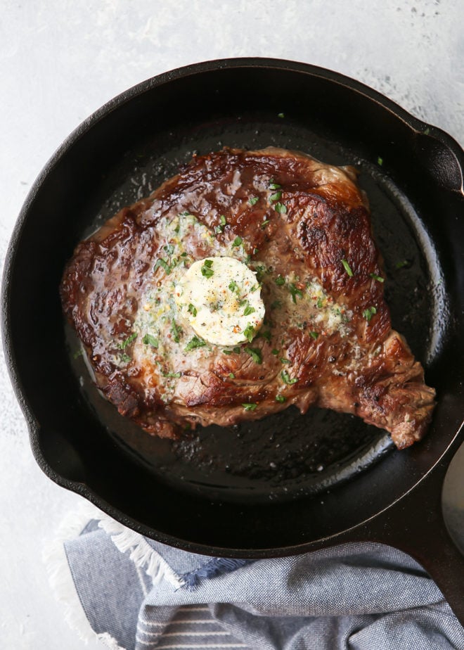 Grilled ribeye steaks with cowboy butter