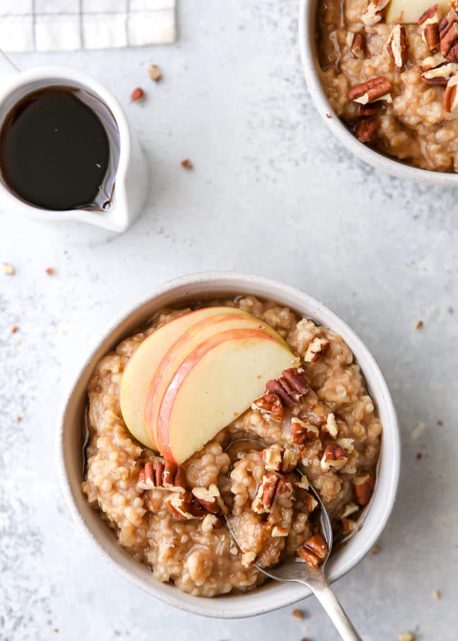 These apple cinnamon oatmeal bowls made in the pressure cooker and topped with pecans and maple syrup are perfect for fall!
