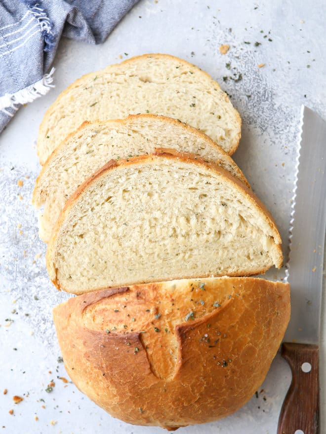 Bake this easy herb bread loaf in your dutch oven for a crispy crust!