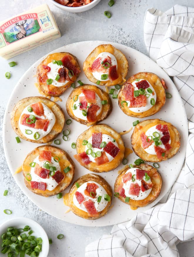 These irresistible baked potato bites are loaded up with cheese, sour cream, bacon and chives