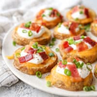 These irresistible baked potato bites are loaded up with cheese, sour cream, bacon and chives