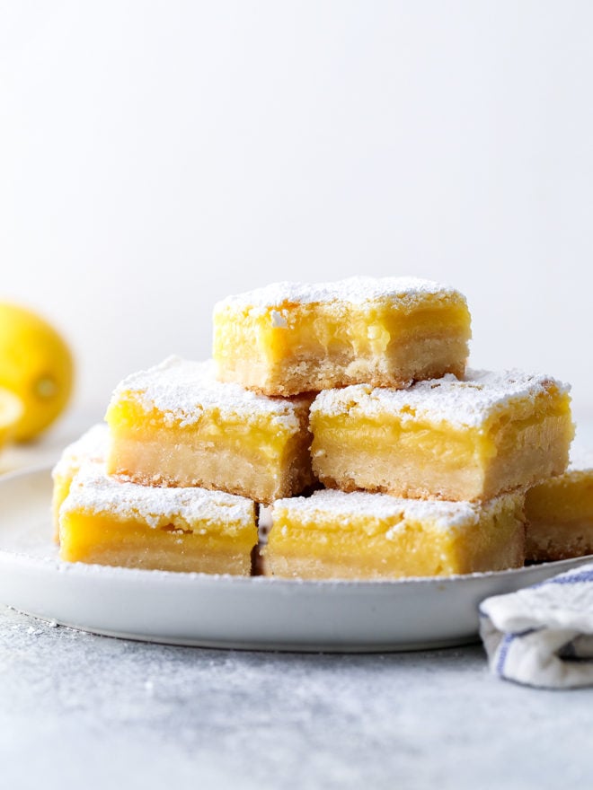 Classic lemon bars with a buttery shortbread crust, tart lemon filling, and powdered sugar topping are always a crowd favorite!