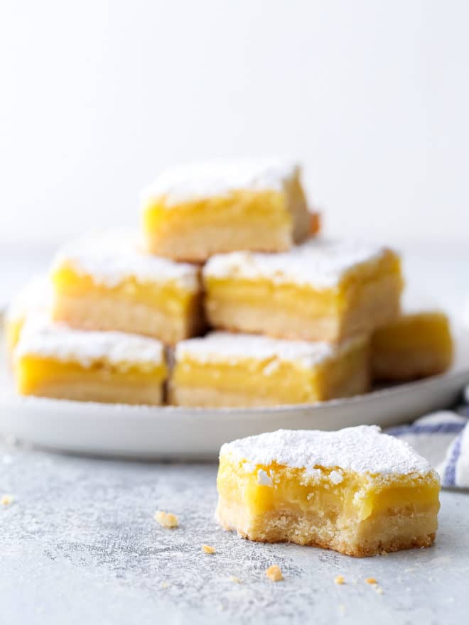 Classic lemon bars with a buttery shortbread crust, tart lemon filling, and powdered sugar topping are always a crowd favorite!