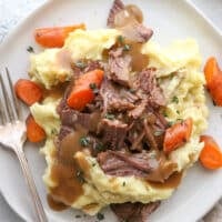 This classic pot roast recipe cooked in the slow cooker is fall-apart tender and full of so much flavor.
