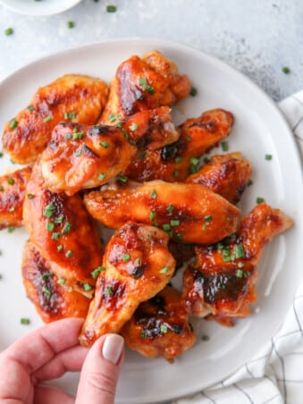 These chicken wings are baked in the oven until crispy and then glazed with a sweet and spicy maple sauce.