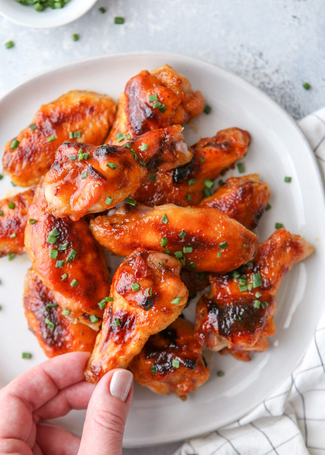 These chicken wings are baked in the oven until crispy and then glazed with a sweet and spicy maple sauce.
