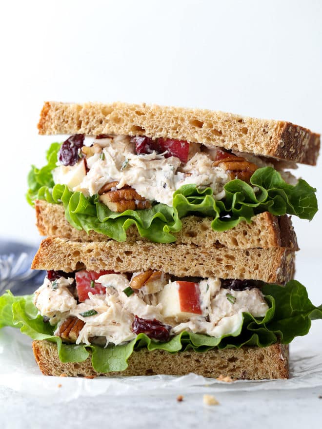 This delicious chicken salad is filled with shredded chicken, chopped pecans, diced apples, dried cherries, and a rosemary scented dressing.