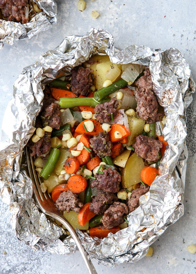 These beef and veggie tin foil dinners are an entire meal wrapped up in foil and cooked on the grill, over a fire, or in the oven.