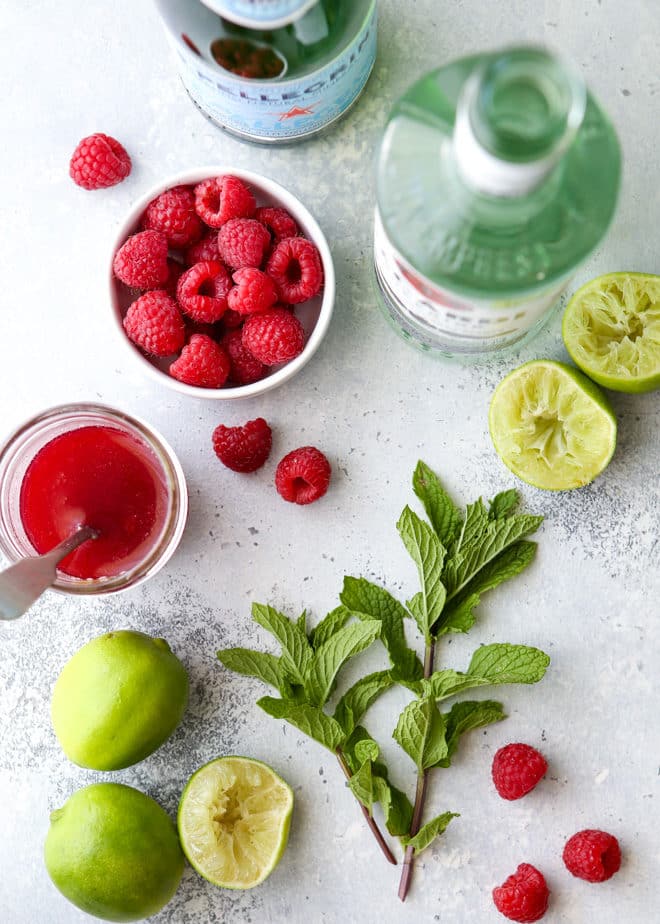 This refreshing raspberry mojito cocktail made with rum, mint, lime, and fresh raspberries is perfect for summer sipping!