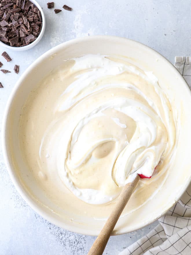 Mixing peanut butter chocolate chunk no-churn ice cream