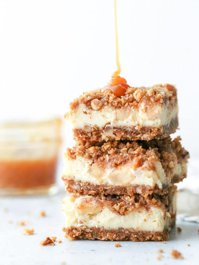 Layers of graham cracker streusel, smooth cream cheese filling, cinnamon apple chunks, and caramel drizzle make up these rich and creamy caramel apple cheesecake bars.