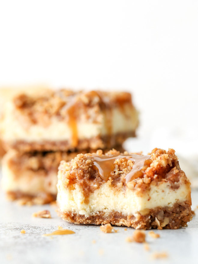 Layers of graham cracker streusel, smooth cream cheese filling, cinnamon apple chunks, and caramel drizzle make up these rich and creamy caramel apple cheesecake bars.