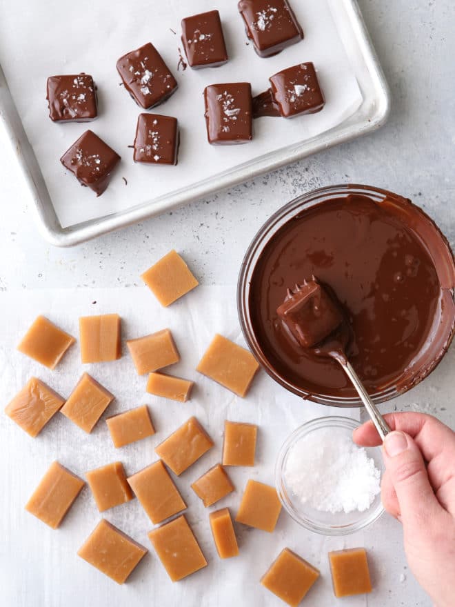 Covering homemade caramels with chocolate