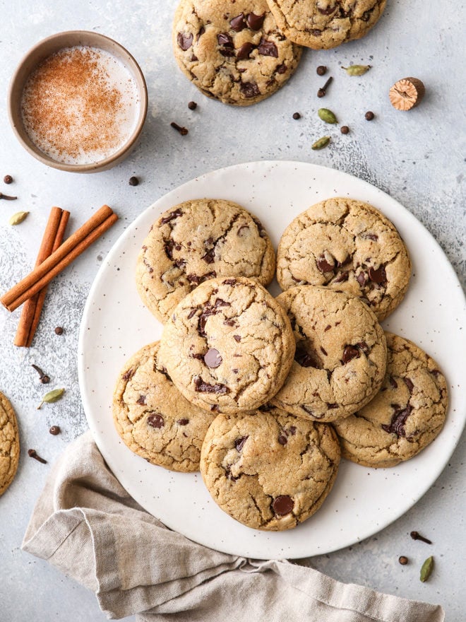 These chai spice chocolate chip cookies are thick and chewy, and loaded up with dark chocolate and warm spices like cardamom, ginger, nutmeg, cinnamon, cloves and allspice.