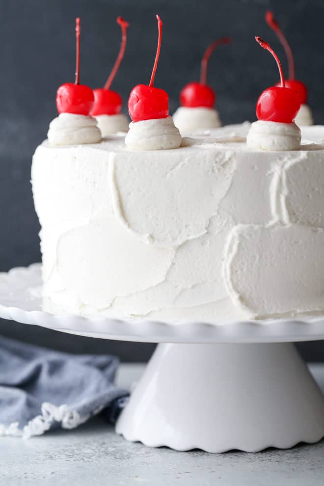This cherry chip cake, smothered in a fluffy whipped vanilla buttercream, is a homemade version of a boxed cake mix favorite. It’s also the perfect celebration cake!