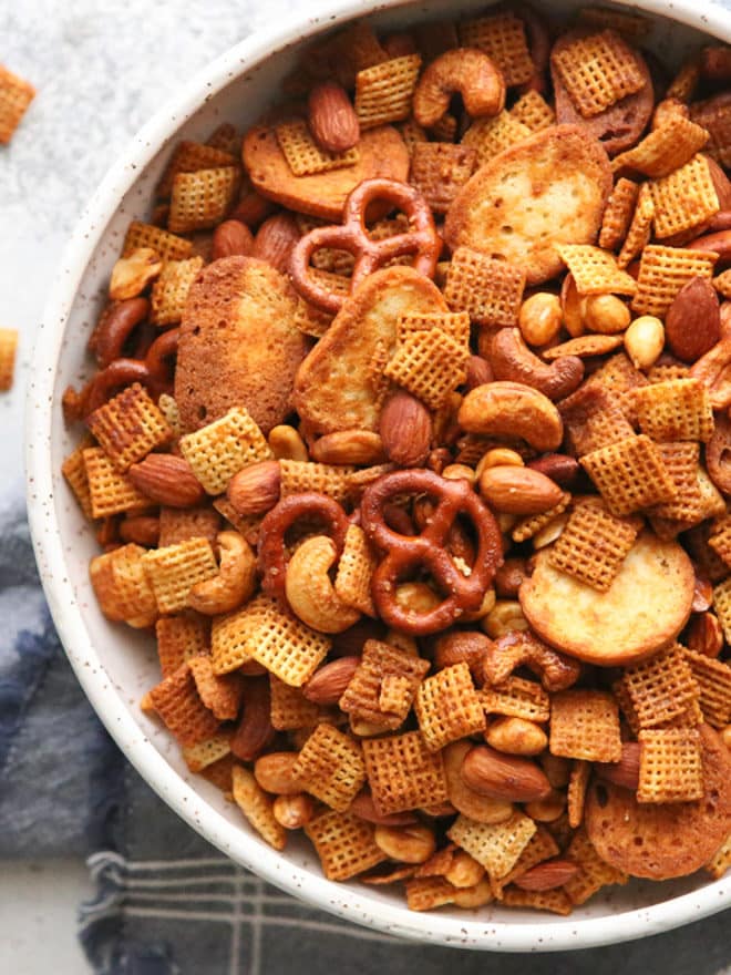 This snack mix filled with rice cereal, pretzels, and nuts is a little bit sweet and a little bit spicy.
