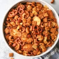 This snack mix filled with rice cereal, pretzels, and nuts is a little bit sweet and a little bit spicy.