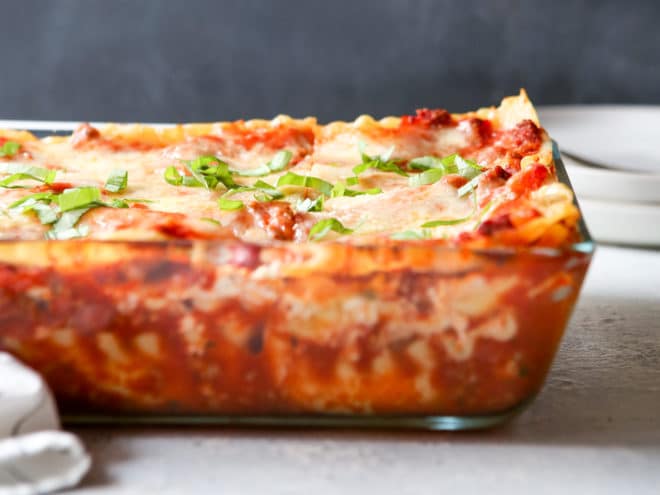 This classic meat lasagna is filled with layers of pasta, homemade meat sauce, and lots of ricotta, mozzarella, and parmesan cheese.