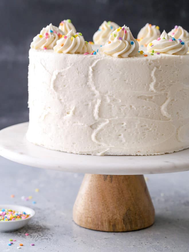 This funfetti cake made with light and buttery vanilla cake layers studded with rainbow sprinkles and fluffy vanilla buttercream frosting is such a fun and cheerful dessert!
