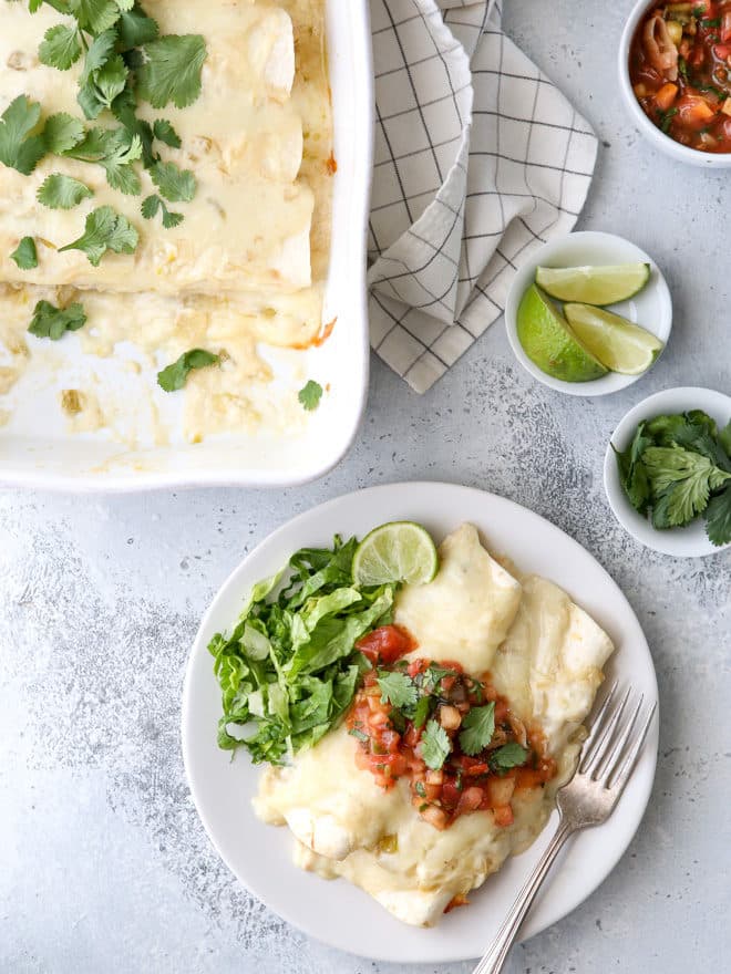 These sour cream chicken enchiladas are a family favorite! They're cheesy, creamy, and made completely from-scratch!