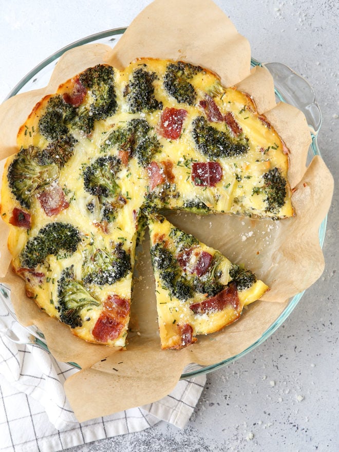 A breakfast bake filled with roasted broccoli, bacon, Gruyere cheese, eggs and chives. It’s a quiche minus the fussy pie crust!