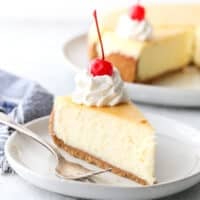 Classic cheesecake with graham cracker crust is silky smooth, ultra rich, and very creamy.