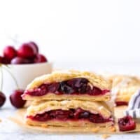 cherry hand pies cut in half and stacked