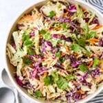 This is the easiest classic coleslaw filled with cabbage, carrots, chives, cilantro and a creamy mayo dressing.