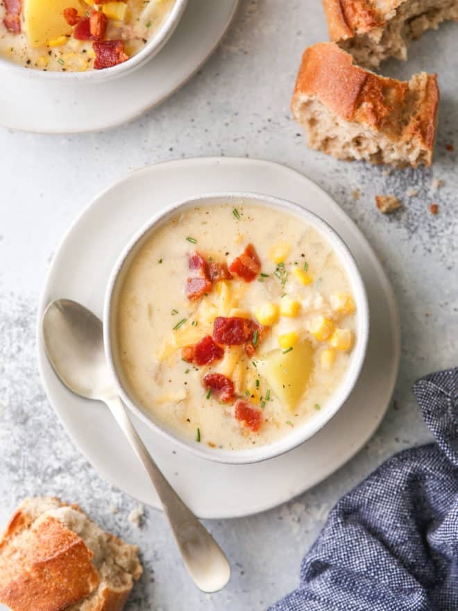 bowl of cheesy corn chowder with torn bread
