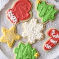 closeup of frosted sugar cookies on a plate