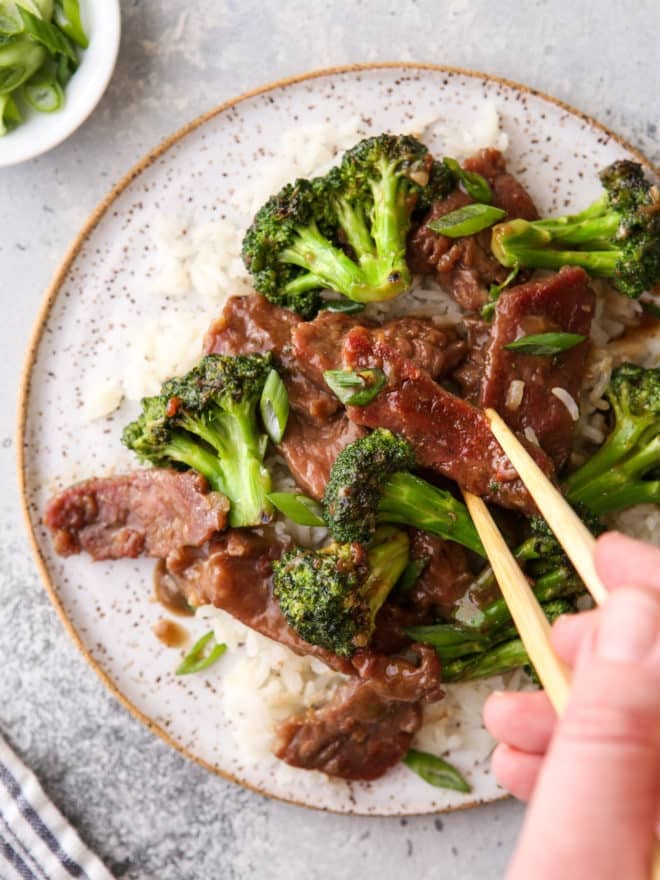 stir fry beef with broccoli and chopstick