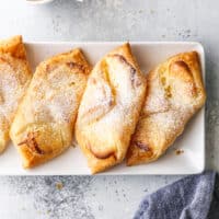 cream cheese danishes on a plate with a cup of coffee