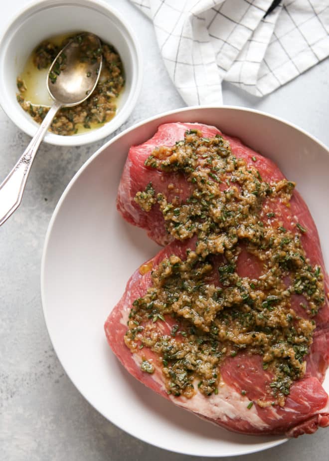marinating tri-tip roast with garlic and herbs